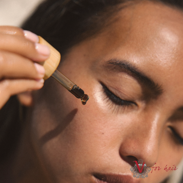 True Tahiti - 100% Pure Tamanu Facial Oil - 30ml dripping serum oil on face