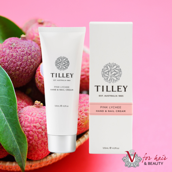 Tilley - Pink Lychee Hand & Nail Cream in front of pink lychee background
